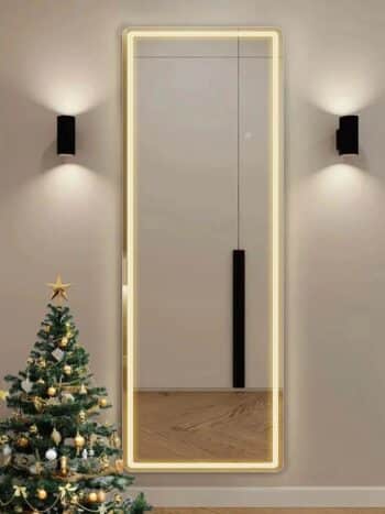 A sleek freestanding light mirror enhancing a modern bedroom decor.