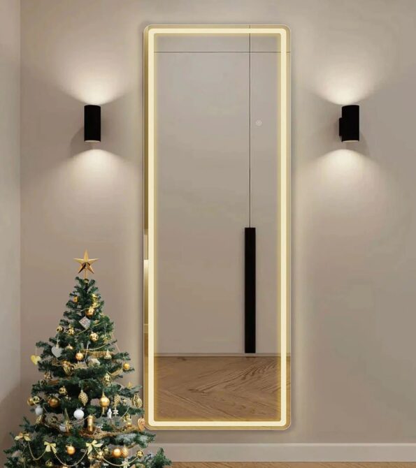 A sleek freestanding light mirror enhancing a modern bedroom decor.